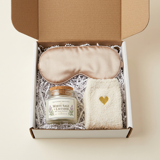 Polished candle, sleep mask, and ivory socks gift-box photo